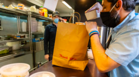 Hourly worker packaging food